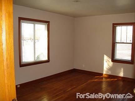 Front bedroom with hardwood floor