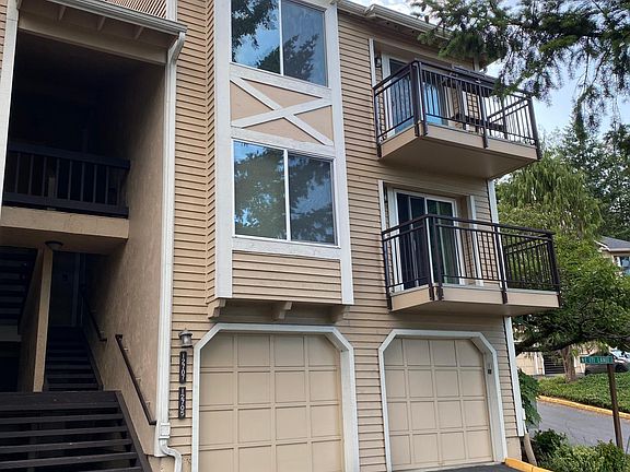 Exterior of the building. The listed unit is on the upper right. The garage and storage area on the lower right belong to the condo. Easy access in and out of the complex.