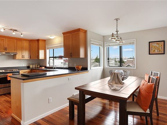 The dining room is open to the kitchen making for easy access when entertaining and creating an open concept space for all to connect.