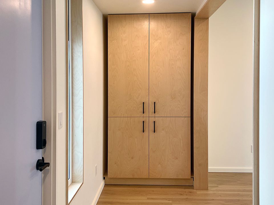 Entryway with built-in closet for coats, shoes, and other household storage