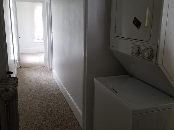 Hallway to bedroom #1 & #2 with washer and dryer.