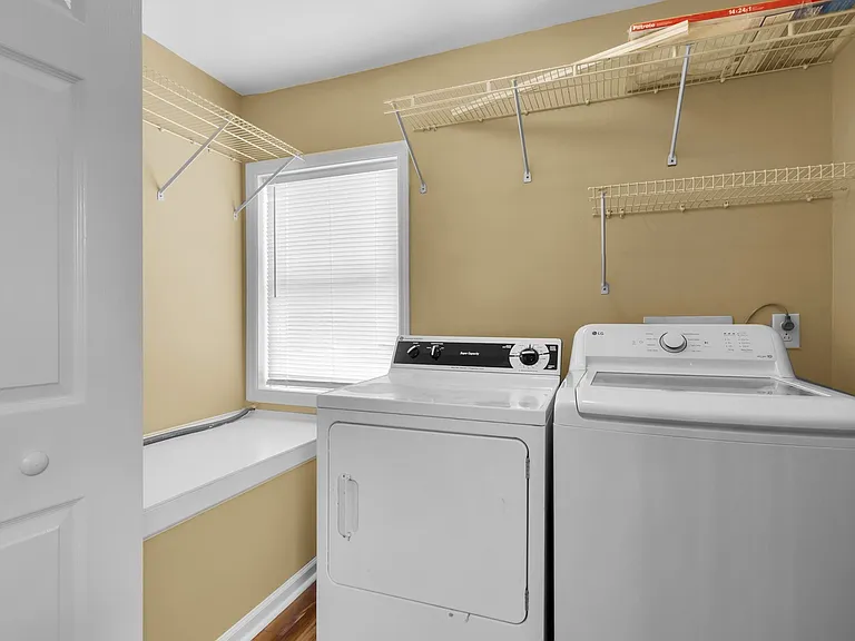 laundry closet with a window