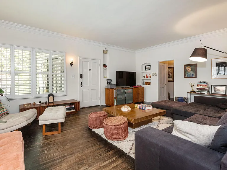 Living room with previous tenants furniture (unit will be delivered empty)
