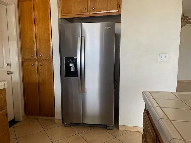 Fairly new Woolpool Refrigerator in a kitchen