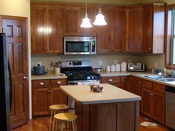 Kitchen with Island and Stainless steel Appliances