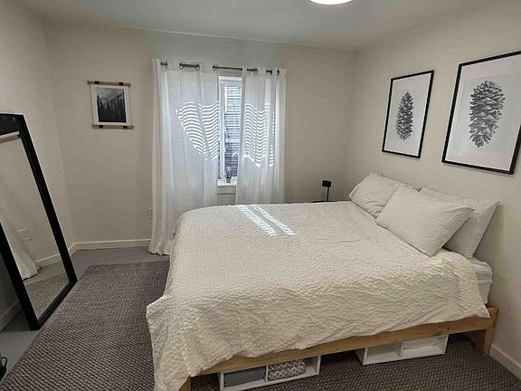 Main bedroom includes french doors with pre-installed retractable blinds on doors