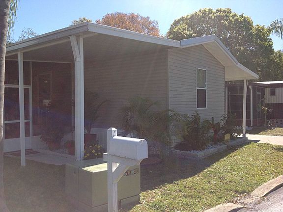 Front of Home with Patio and Attached Screenroom
