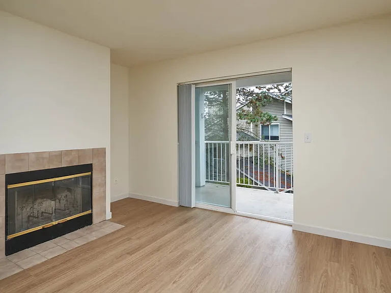 Living Room with Fireplace and Balcony