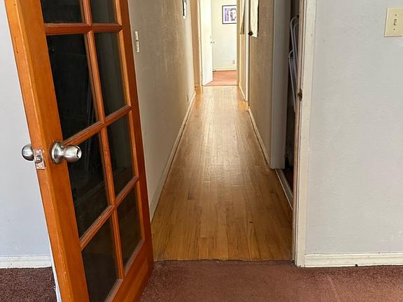 Back large bedroom looking down the hall to the front of the house