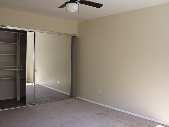 Bedroom with big closet and ceiling fan