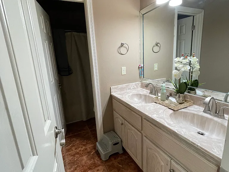 Full Bathroom _ Modern fixtures and neutral design, located between both bedrooms