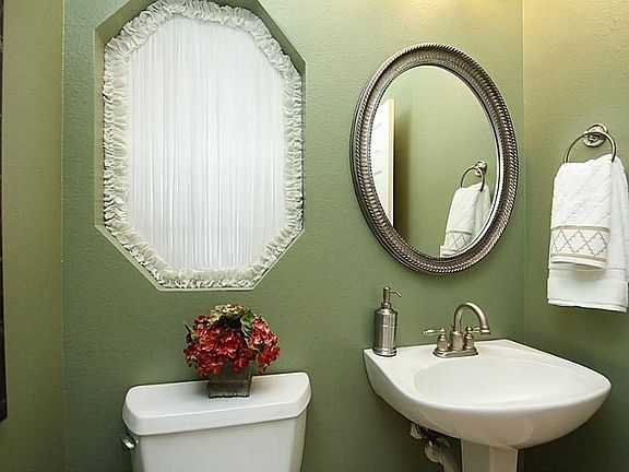 Pretty powder room off the entry hall
