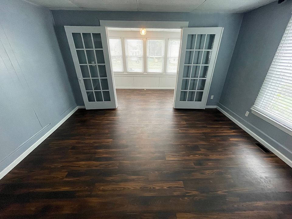 Plenty of room for a big screen tv and your couches in a large family room. Even better, there's a bonus sunroom through a set of glass doors!