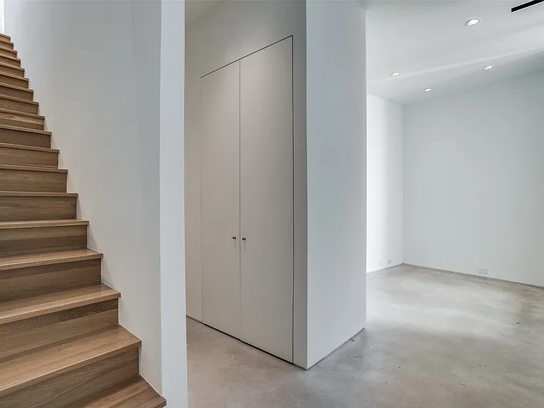 Staircase featuring wood-finish treads and risers