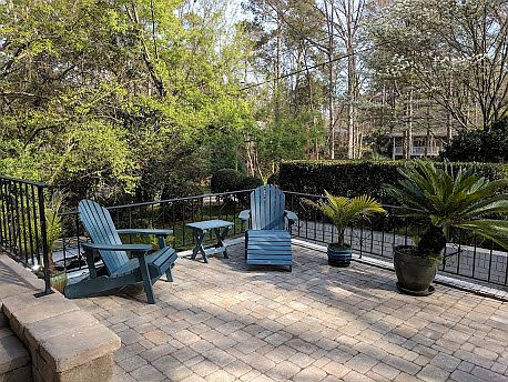 A sunny patio, street-side.