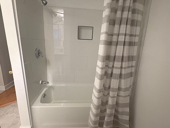 Remodeled bathroom, with tiled bathtub/shower