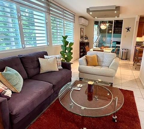Family room overlooking breakfast area with kitchen to the right.