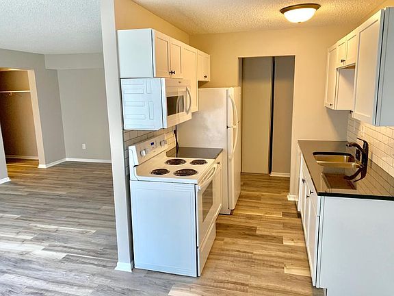 Newly remodelled kitchen, with new wood flooring (throughout unit).