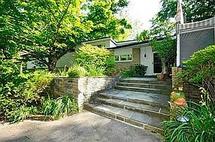 Entry. Large foyer with walnut paneling welcomes you home.
