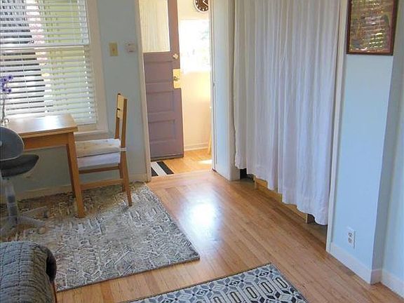 Large closet and dresser behind curtain