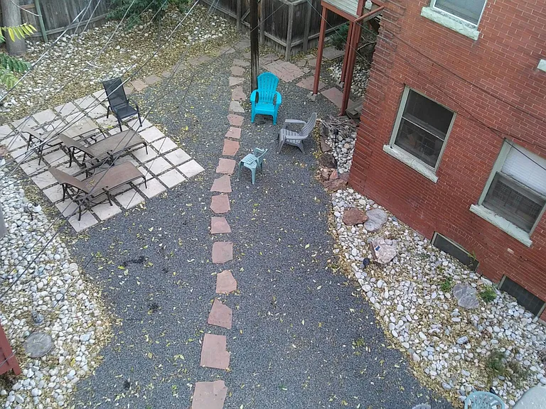Shared yard, with private balcony/deck area shown at left
