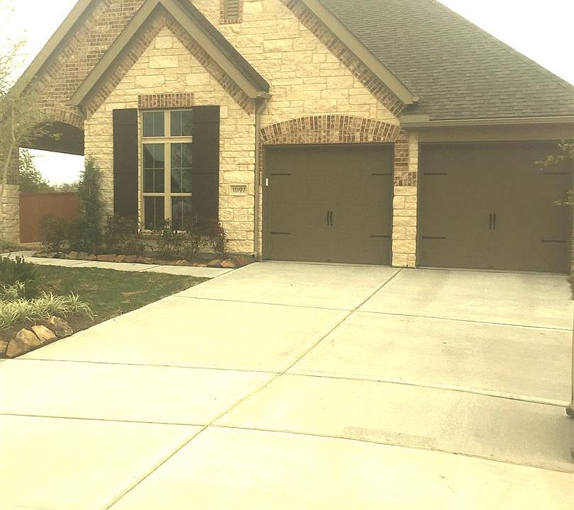 Brick and Stone elevation with two car garage