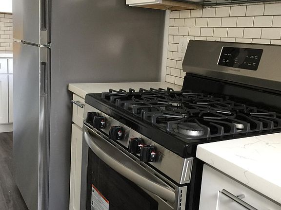 Includes new appliances: Fridge, Gas Stove, Microwave. Washer and Dryer in the Garage.