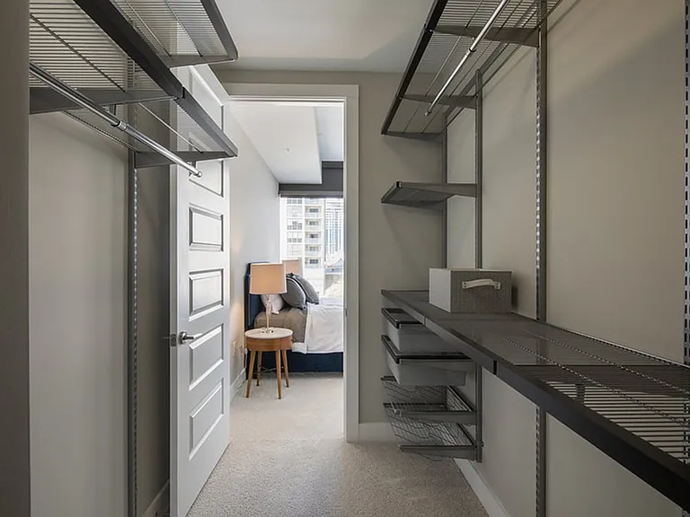 Walk-in closets featuring Elfa shelving