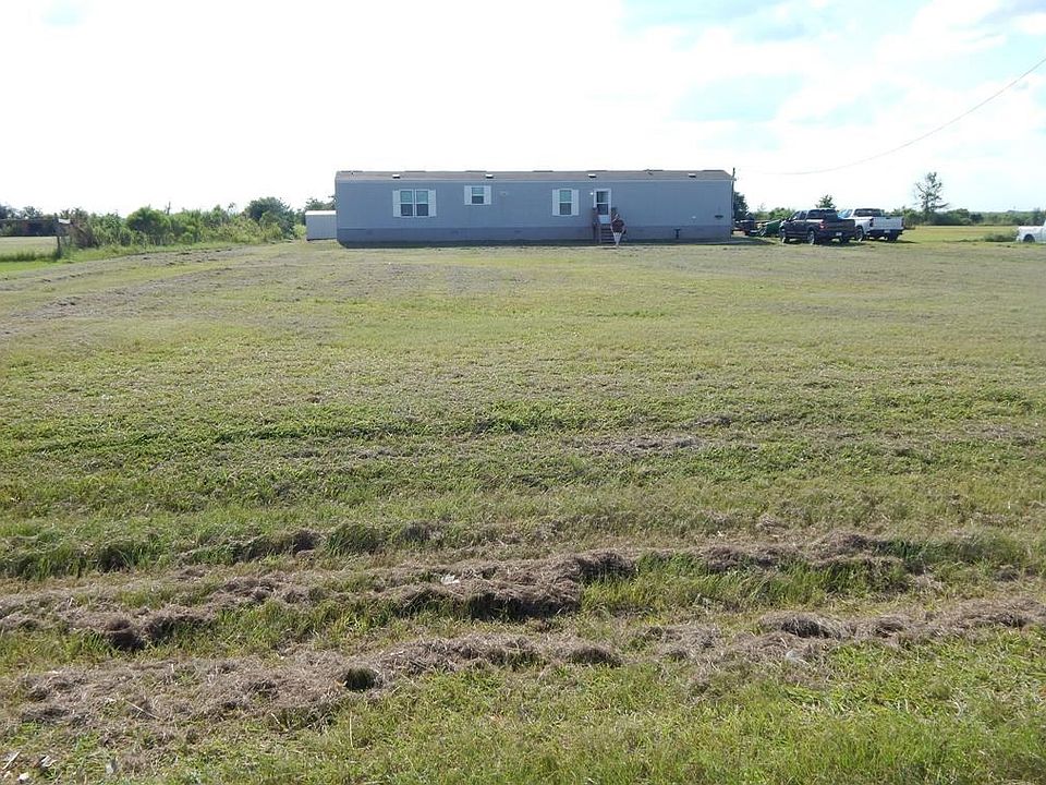 Front view of single-wide home that was high & dry during Harvey.