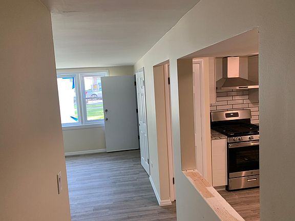 view from hallway into kitchen/living room