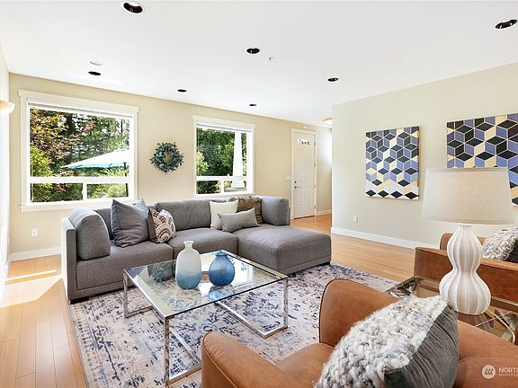 Bright and airy living room with extra large picture windows to enjoy the view!>