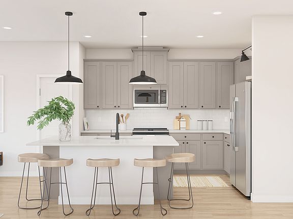 Kitchen with pendant lighting and gorgeous countertops