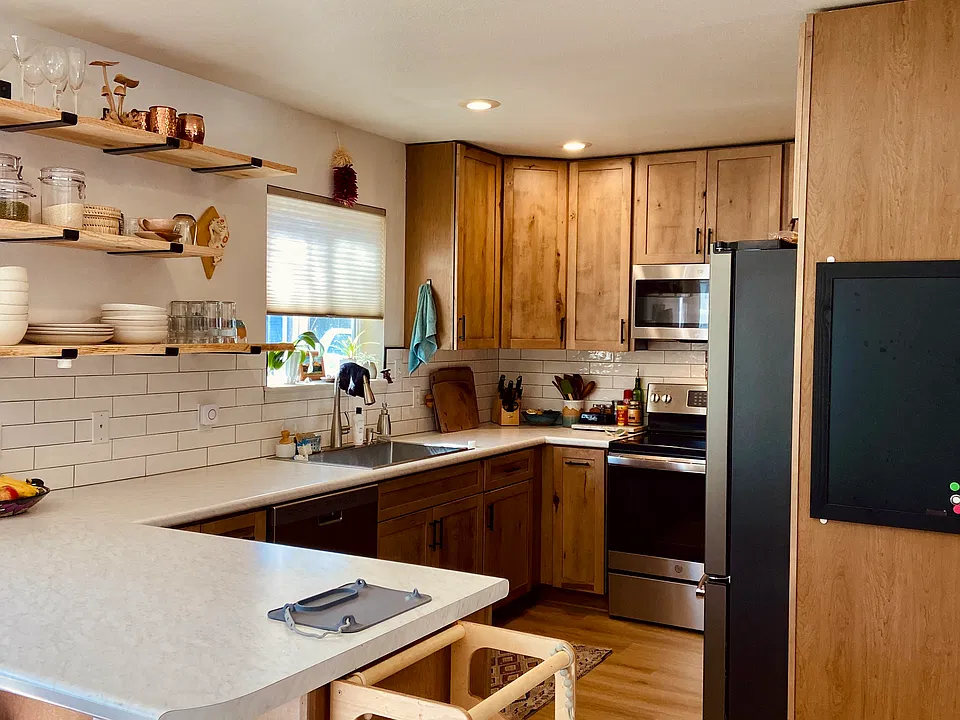 Brand new kitchen with beetle kill pine shelves and custom cabinets.