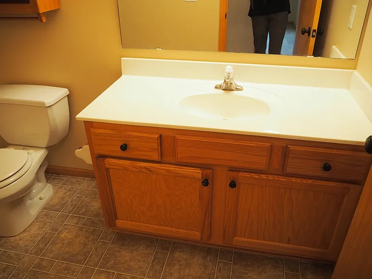 Upper hallway bathroom serves both bedrooms.