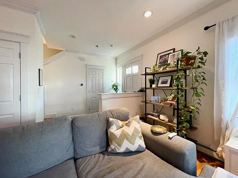 Front door and foyer (opens into living area)