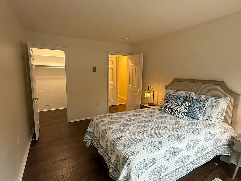 Bedroom with view of walk-in closet