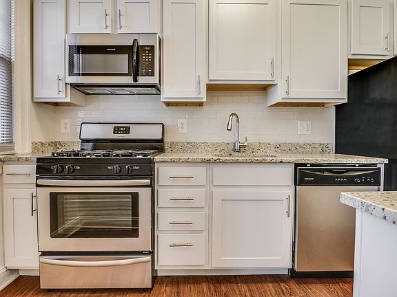 Renovated kitchen with stainless steel appliances and granite countertops