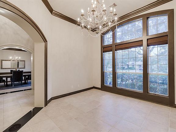 Light and Bright Formal Living Room is to your left as you enter the home. The Large Arched Window is gorgeous and the Chandelier adds the perfect degree of elegance to this room that you can use as your family's needs dictate.