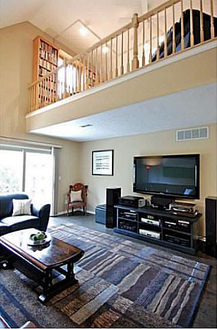 Living Room with vaulted ceilings.  Imported cork floor.