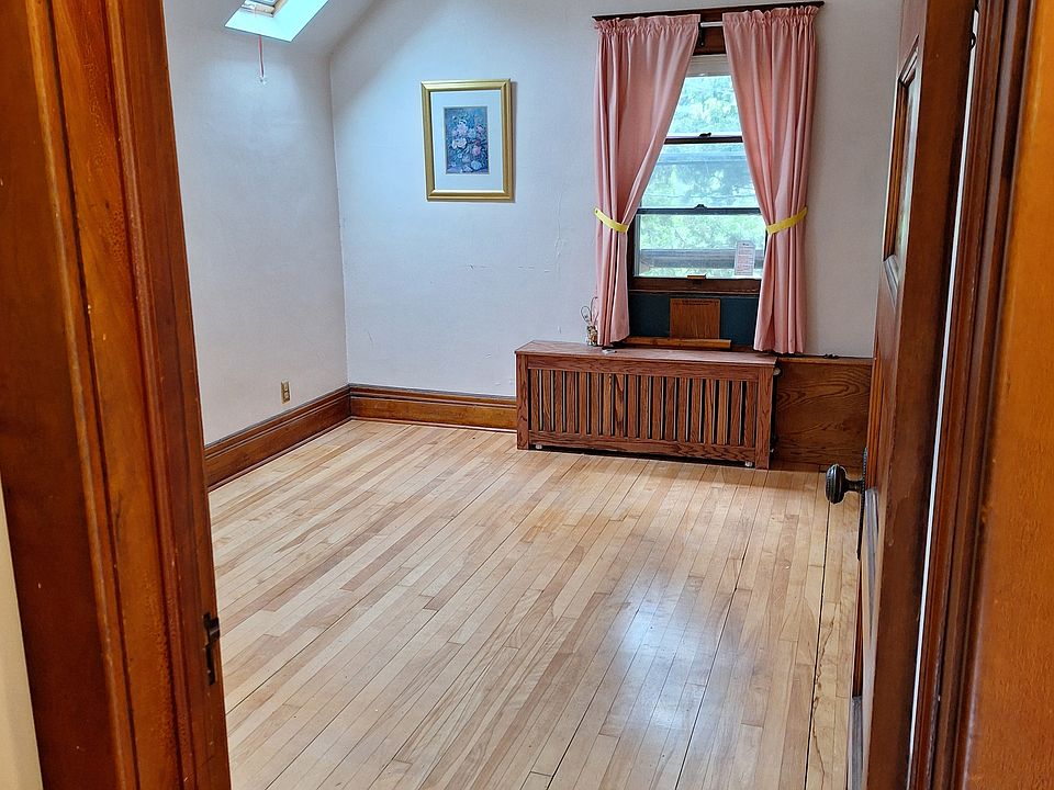 Bedroom with maple hardwood floors. Main window faces west. Skylight on south side. Walk-in closet on right side.