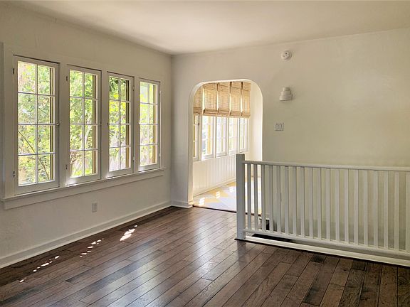 Living Room and Staircase Balcony to Basement