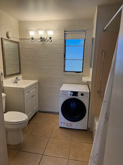 The Bathroom has a new vanity, new combo washer & dryer