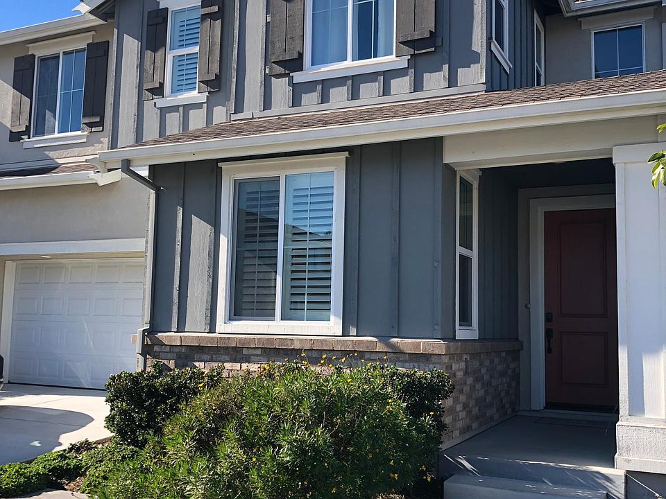 Beautiful, inviting Craftsman style home with mature landscaping.
