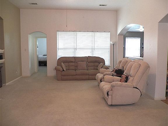 Another view of the family room - arched pass-through on right joins the breakfast and kitchen areas.