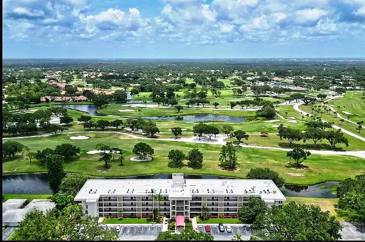 Easterly aerial view of our building and past the Palm Aire Championd Golf Course.