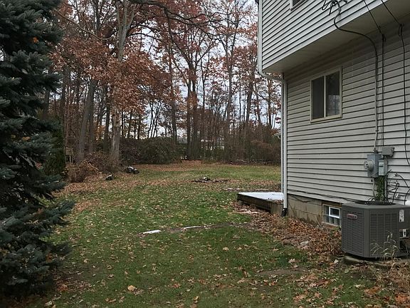 Large back yard with mature trees
