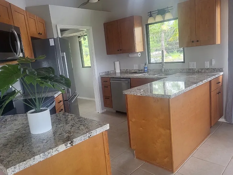 New Kitchen with Granite countertops and stainless steel appliances.