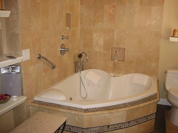 Master bath includes 36 jet VitaBath spa tub with overhead rain shower.