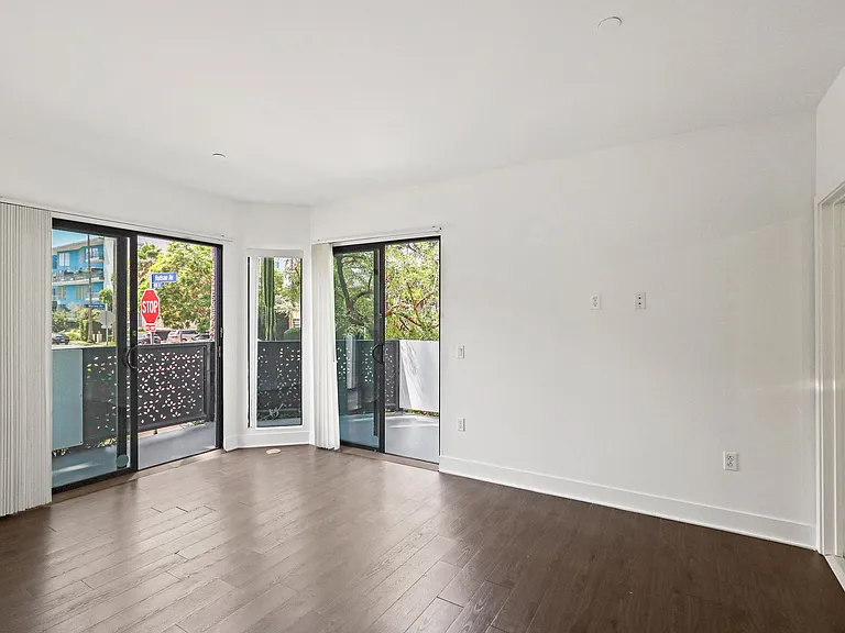 Bedroom with Walk-In Closet, Bathroom, and Patio