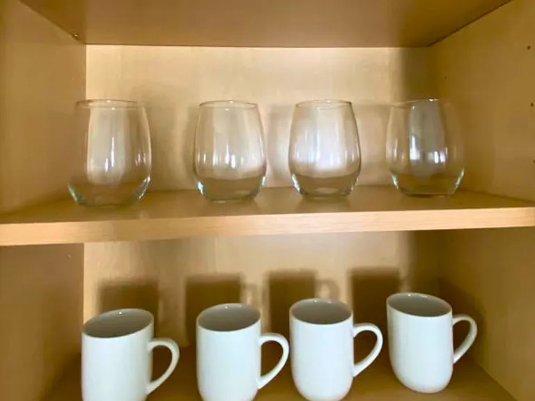 Elegant glass cups and mugs ready for your stay.